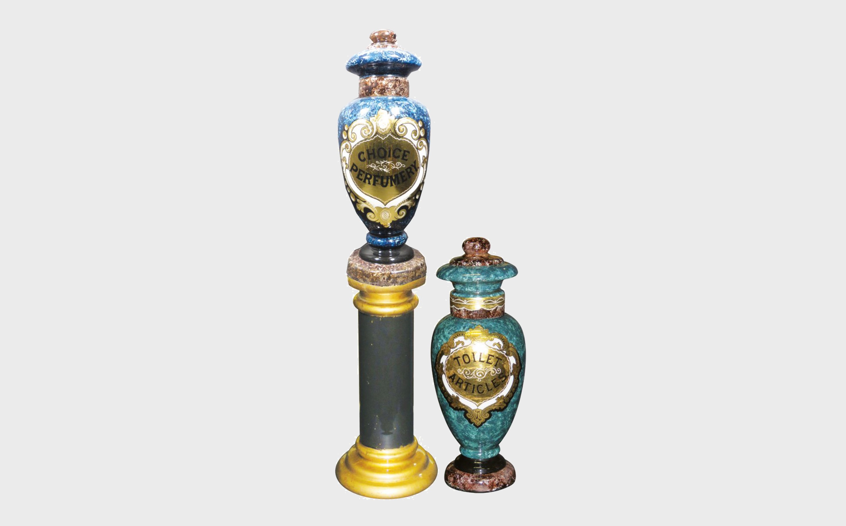 Two reverse Glass Show Globes
